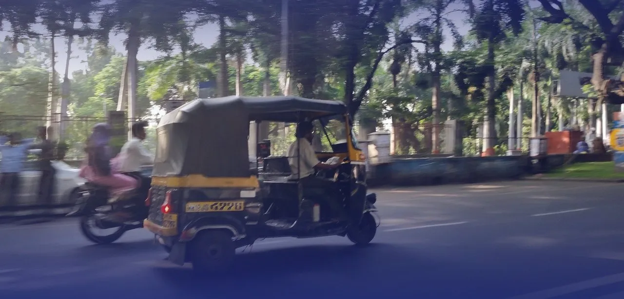 An auto rickshaw on a Pune street, outlined in a hand-drawn sketch.